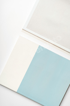 Stack of blank paper on beige background