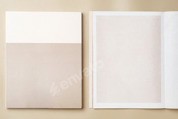 Stack of blank paper on beige background