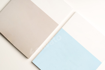 Stack of blank paper on beige background