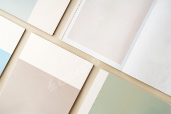 Stack of blank paper on beige background