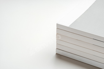 Stack of blank paper on beige background