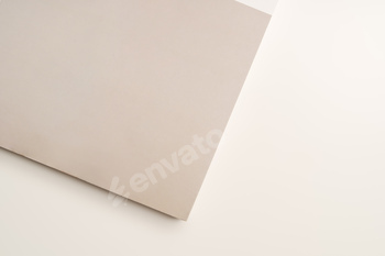 Stack of blank paper on beige background