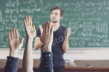 the students at school with raised handsб classroom learning together