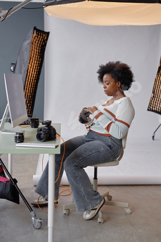 Photographer Cleaning Photo Equipment