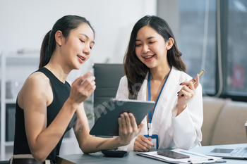 businesswoman  working on a project in the office or reviewing and discussing a business project.