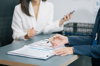 businesswoman  working on a project in the office or reviewing and discussing a business project.