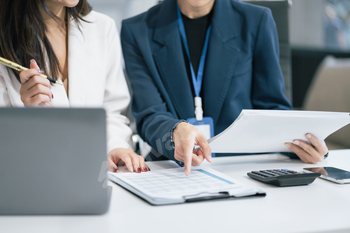 businesswoman  working on a project in the office or reviewing and discussing a business project.