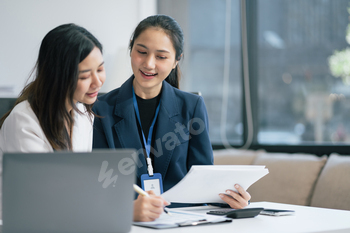 businesswoman  working on a project in the office or reviewing and discussing a business project.