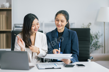 businesswoman  working on a project in the office or reviewing and discussing a business project.