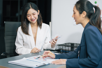 businesswoman  working on a project in the office or reviewing and discussing a business project.