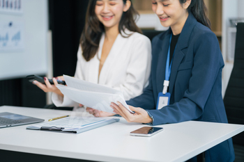 businesswoman  working on a project in the office or reviewing and discussing a business project.