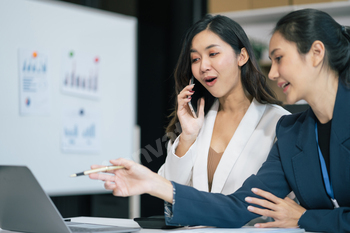 businesswoman  working on a project in the office or reviewing and discussing a business project.