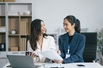 businesswoman  working on a project in the office or reviewing and discussing a business project.