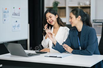 businesswoman  working on a project in the office or reviewing and discussing a business project.