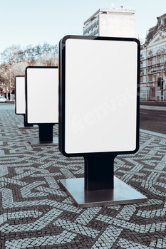 Blank billboards on urban sidewalk