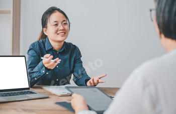 HR managers are interviewing job applicants who fill out their resume on the job application form in