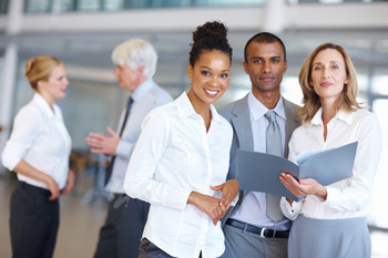 Smiling executives with documents