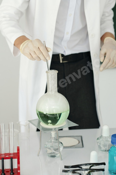 Conducting Chemistry Experiment with Laboratory Equipment