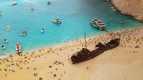 Aerial drone view of the Navagio beach on the Ionian Sea coast of Zakynthos, Greece. Moored boat