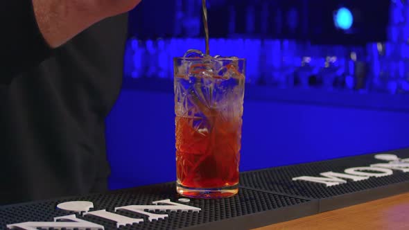 Professional Bartender Creating a Cocktail Drink