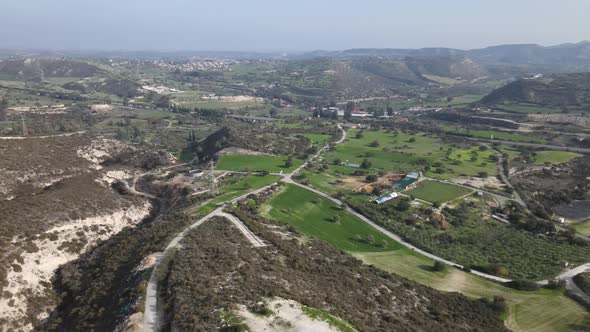 Types of Cyprus in the mountains. Top view of the mountains and human structures.