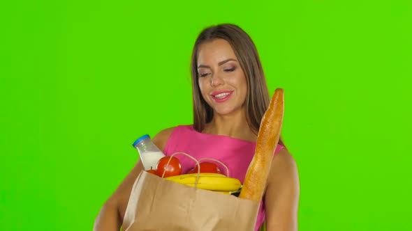 Woman Holding Bag with Groceries Food, Green Screen