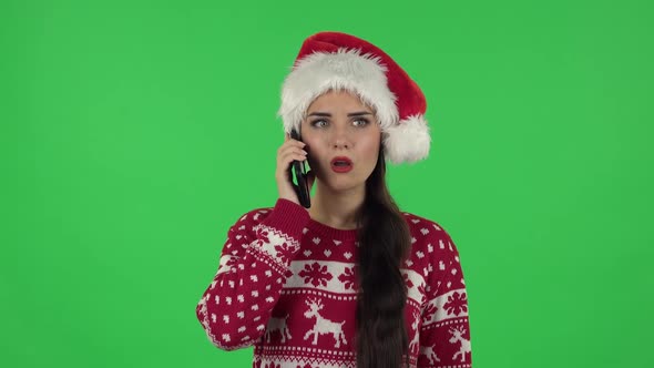 Portrait of Sweety Girl in Santa Claus Hat Very Shocked Then Upset. Green Screen