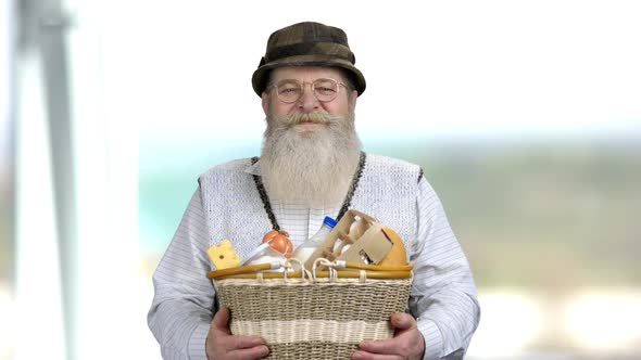 Cheerful Farmer Giving Basket Full of Dairy Products.