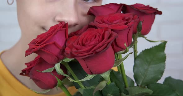 Teen Touching Flowers in Hands