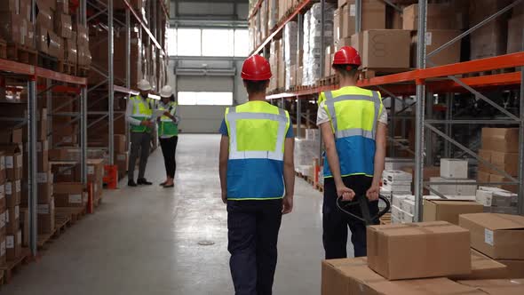 Warehouse Staff and Managers During Working Day