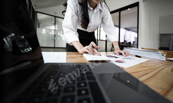 Businesswoman working on calculator, calculate, analyze business and marketing growth