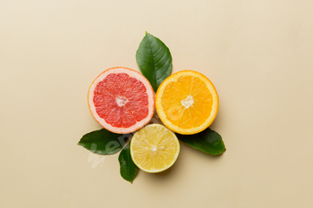 Fruit background. Colorful fresh fruits on colored table. Orange, lemon