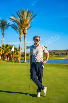 Portrait of a golf instructor standing on a green course