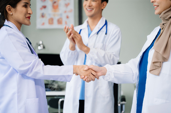 Doctor handshake and partnership in healthcare, medicine or trust for collaboration, unity