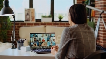 Manager holding online videocall with remotely working employees