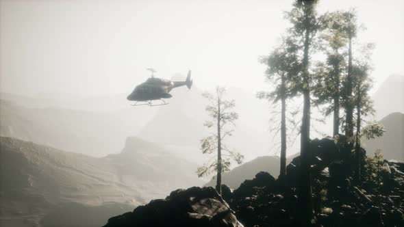 Extreme Slow Motion Flying Helicopter Near Mountain Forest