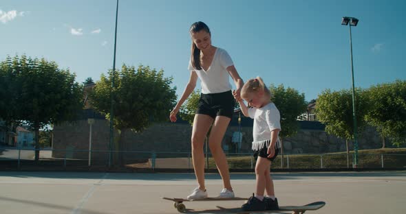 Mother Teach Her Daughter Skateboarding Family Leads Active Lifestyle Together