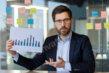 Businessman presenting financial chart in office meeting discussion