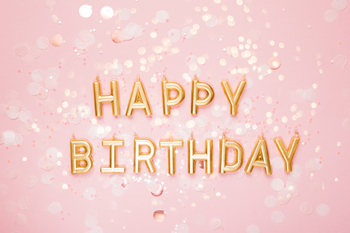 Happy Birthday Candles with Pink Confetti Background