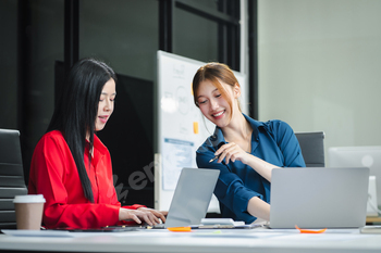 Business woman and partner using calculator and laptop for calculation finance, tax, accounting