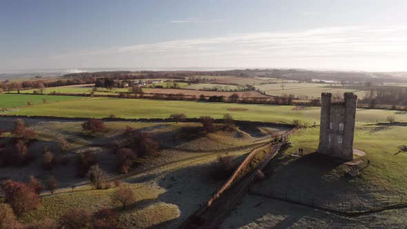 Aerial drone video of Broadway Tower, a famous old building landmark in The Cotswolds Hills, iconic 