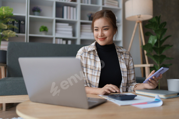 Smart Mortgage Planning woman using a calculator to make Calculations and Consideration