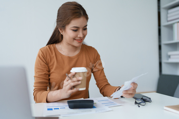 Smart Mortgage Planning woman using a calculator to make Calculations and Consideration