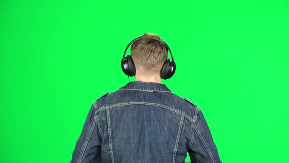 Back View of Guy in Big Headphones Is Running, Chroma Key