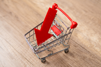 A miniature shopping cart with downward-pointing red arrow.