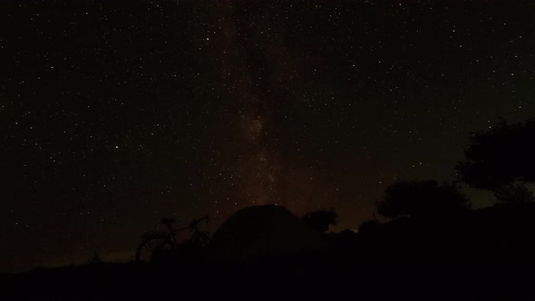 Bicycle And Tent Starry Night Timelapse