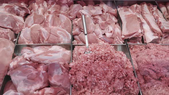 Meat Products on the Counter of a Shop Window