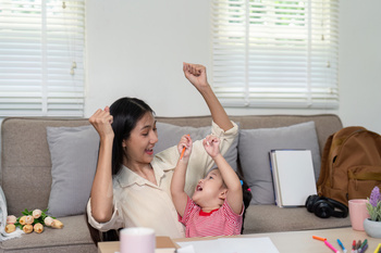 Mother and daughter celebrating creativity with joy