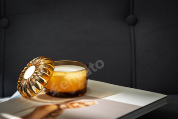 Amber Glass Candle Jar and Magazine on the couch