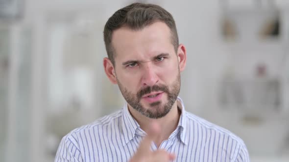 Portrait of Upset Young Man Feeling Angry